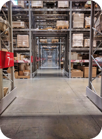 Warehouse racking aisle stocked with boxed goods