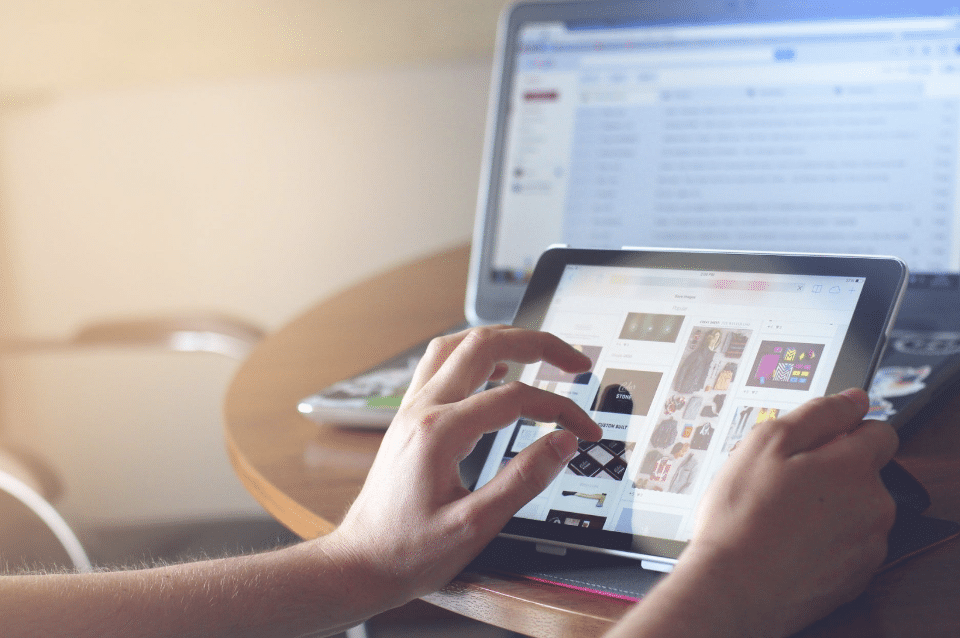 Person browsing an e-commerce store on a laptop while shopping online