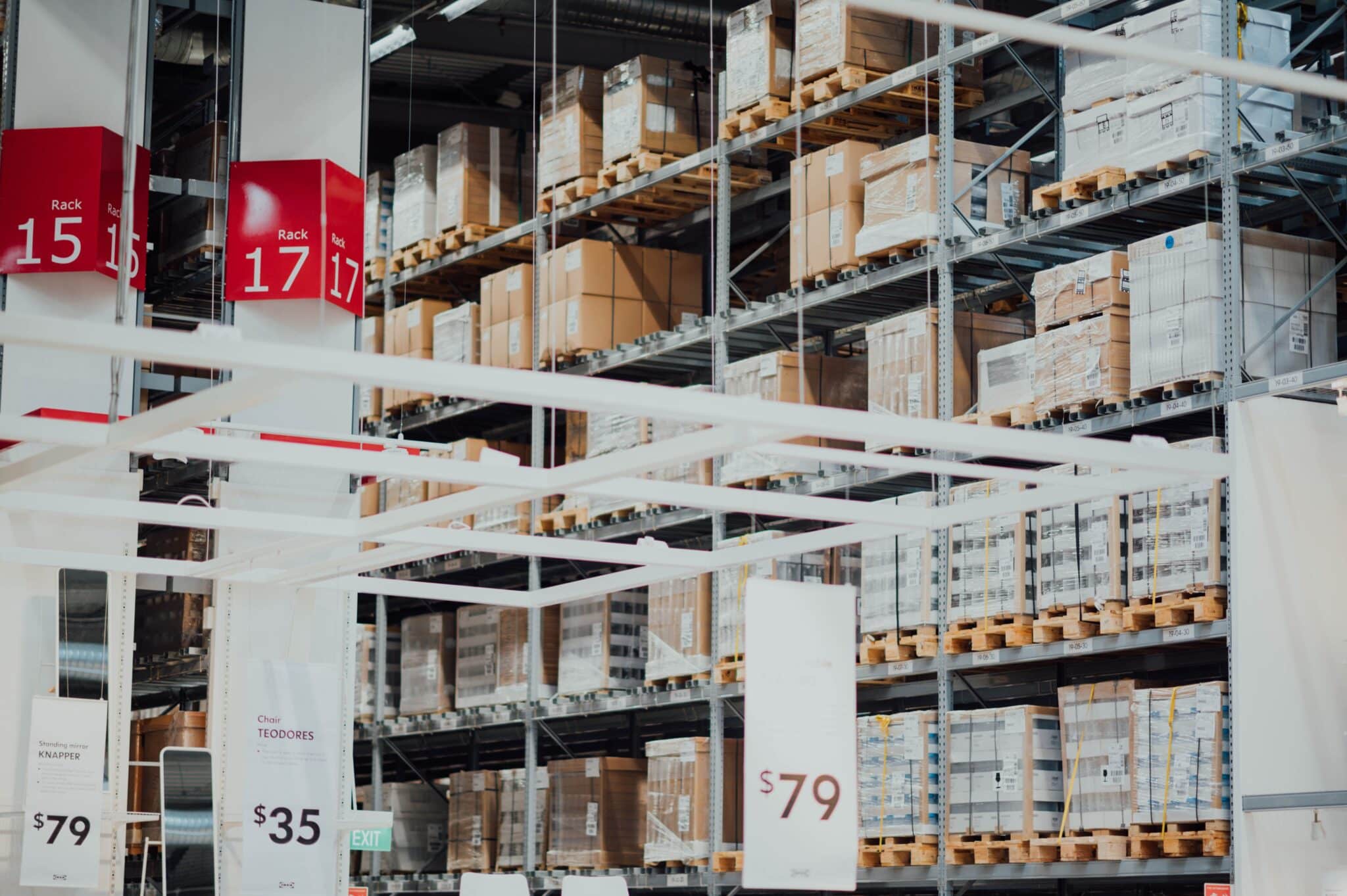 Interior of a warehouse with tall racking and palletised inventory
